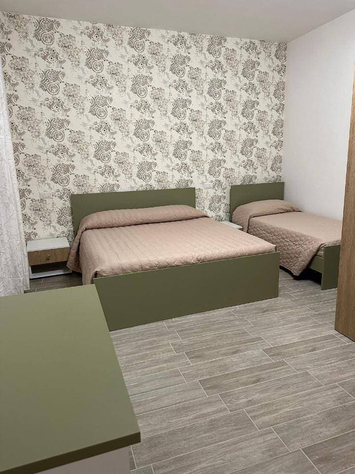 Foto 9 von 13: Triple Room with Private Bathroom