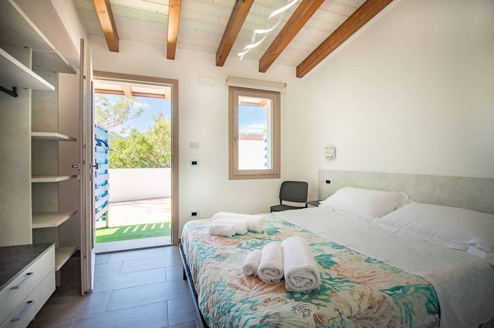 Foto 2 von 13: S'Omu e Chicchinu rooms