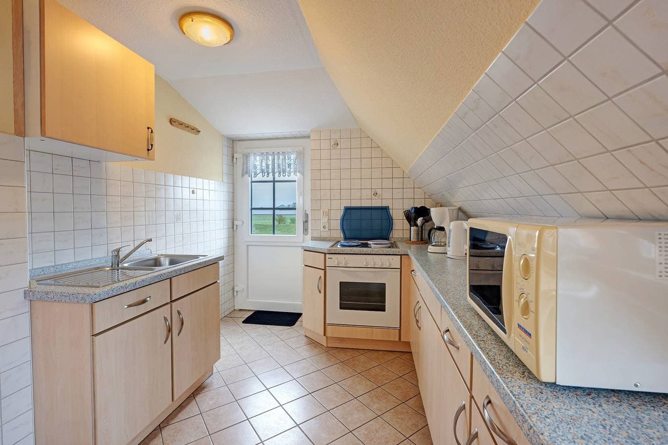 Foto 10 von 25: Ferienwohnung 'Ebbe Und Flut' mit Gemeinschaftsgarten und Balkon