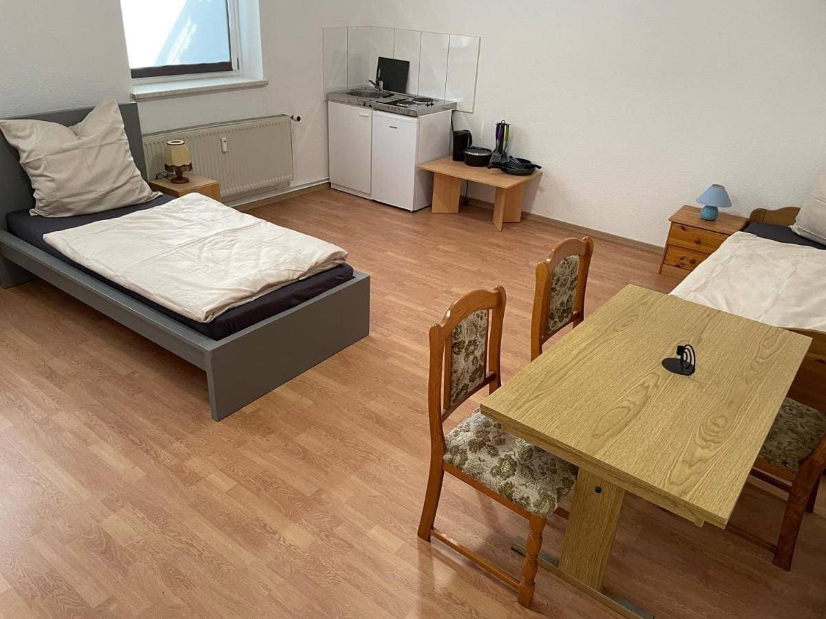Foto 4 von 25: Triple Room with Private Bathroom