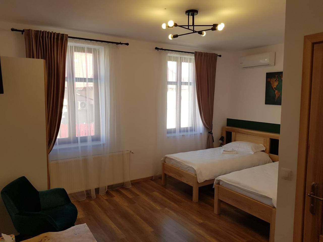 Foto 7 von 11: Triple Room with Private Bathroom