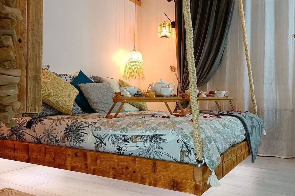 Foto 2 von 27: Gemütliches Apartment mit Whirlpool-Badewanne im Schlafzimmer und Katamaran-Netz