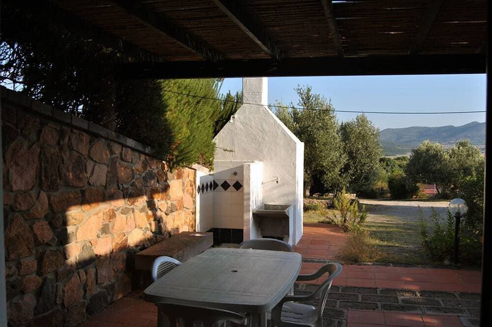 Foto 6 von 8: Wohnung im Erdgeschoss, Veranda mit Grill, Garten, Tennisplatz