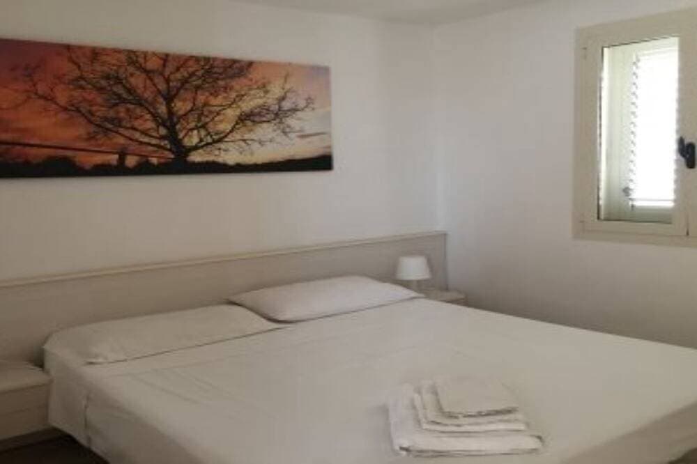 Foto 2 von 12: Zwei-Zimmer-Dachgeschosswohnung mit Aussicht nur 100 Meter vom Strand Torre Mozza entfernt