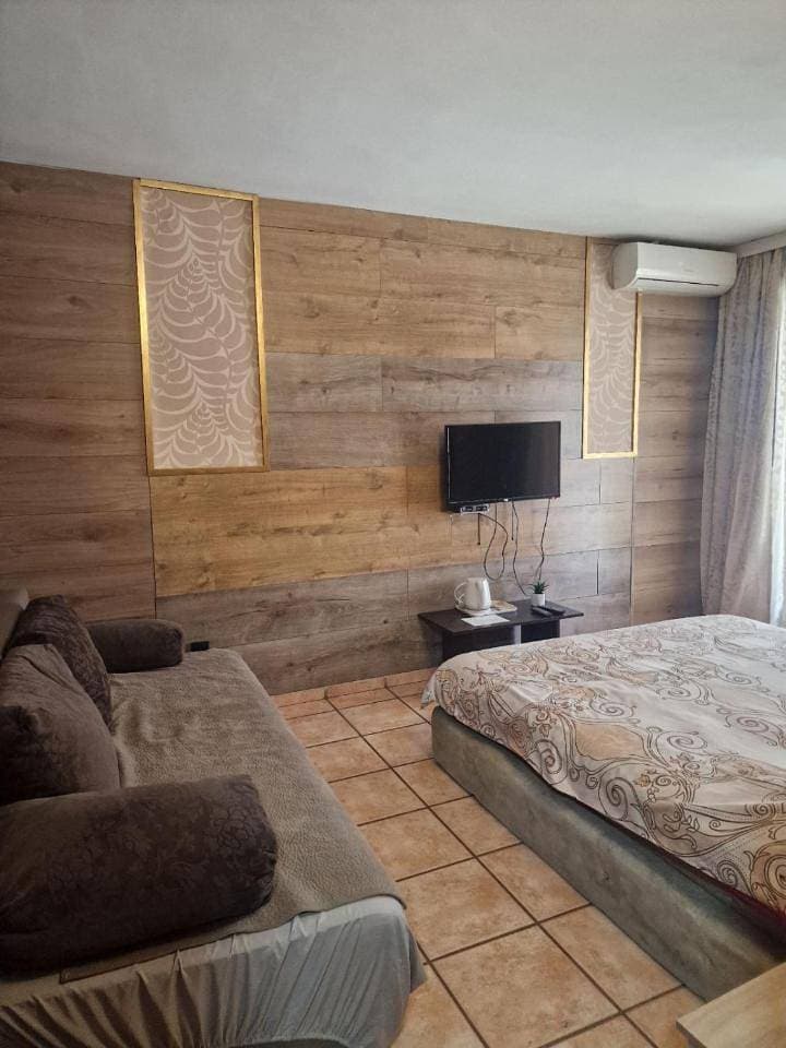 Foto 8 von 12: Basic Triple Room with Shared Bathroom