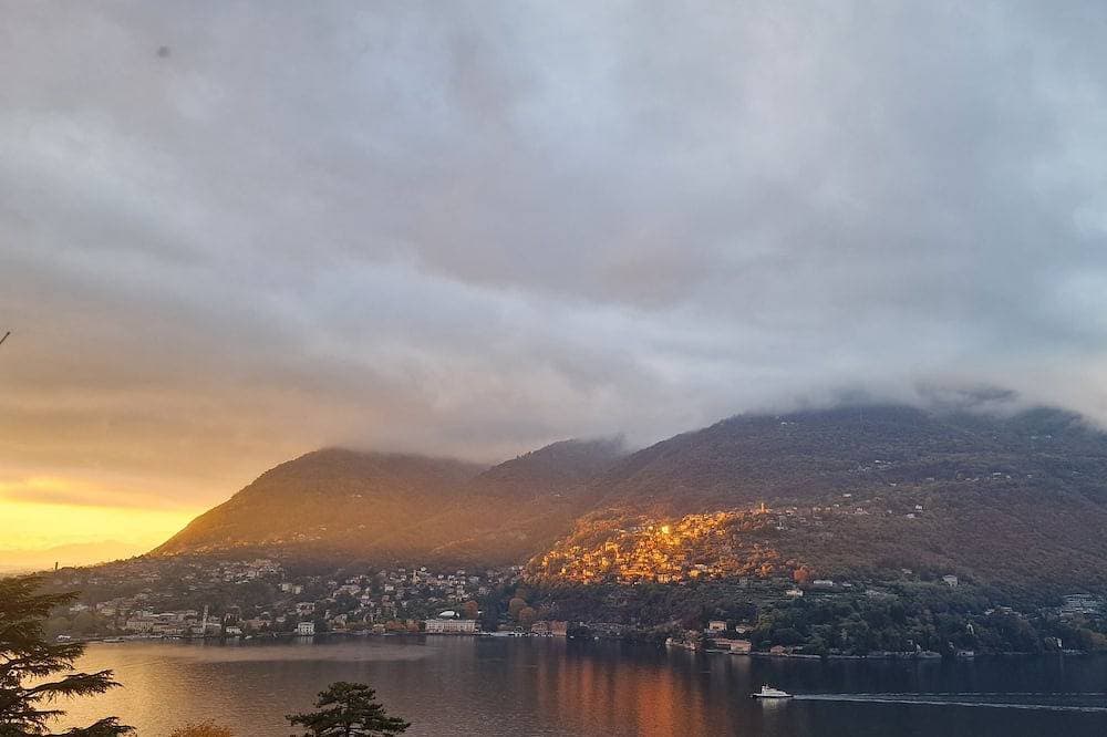 From the apartment and terrace view of the Lake, and with private parking space 1