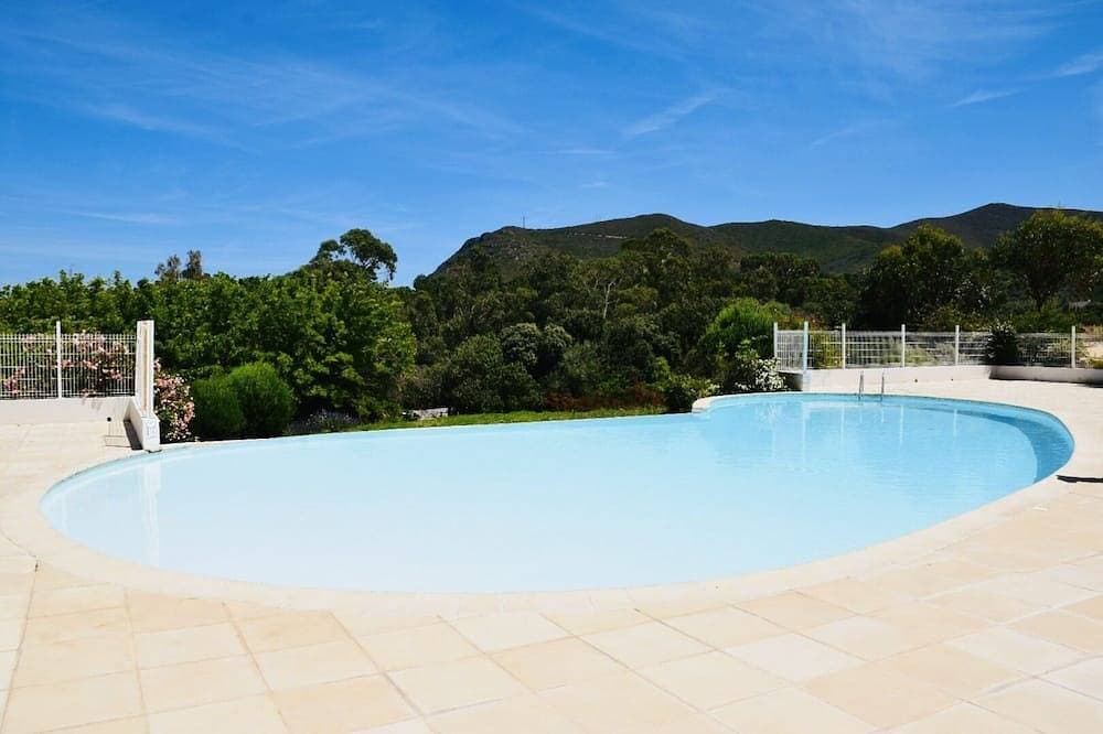 Charming residence with waterfront pool. 1