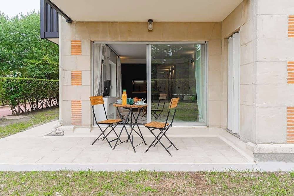 Foto 11 von 12: Appartement au bord de la mer avec Jardin