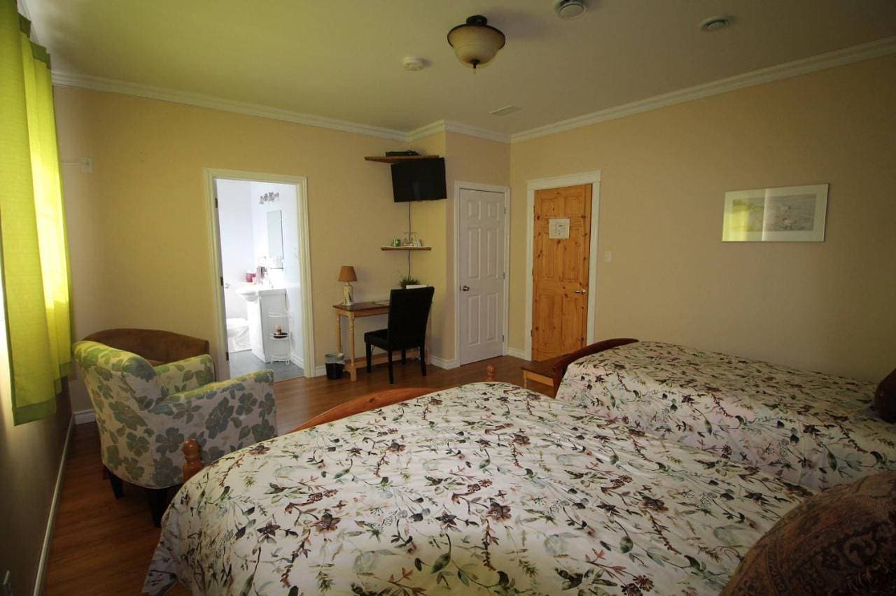Foto 7 von 11: Triple Room with Garden View
