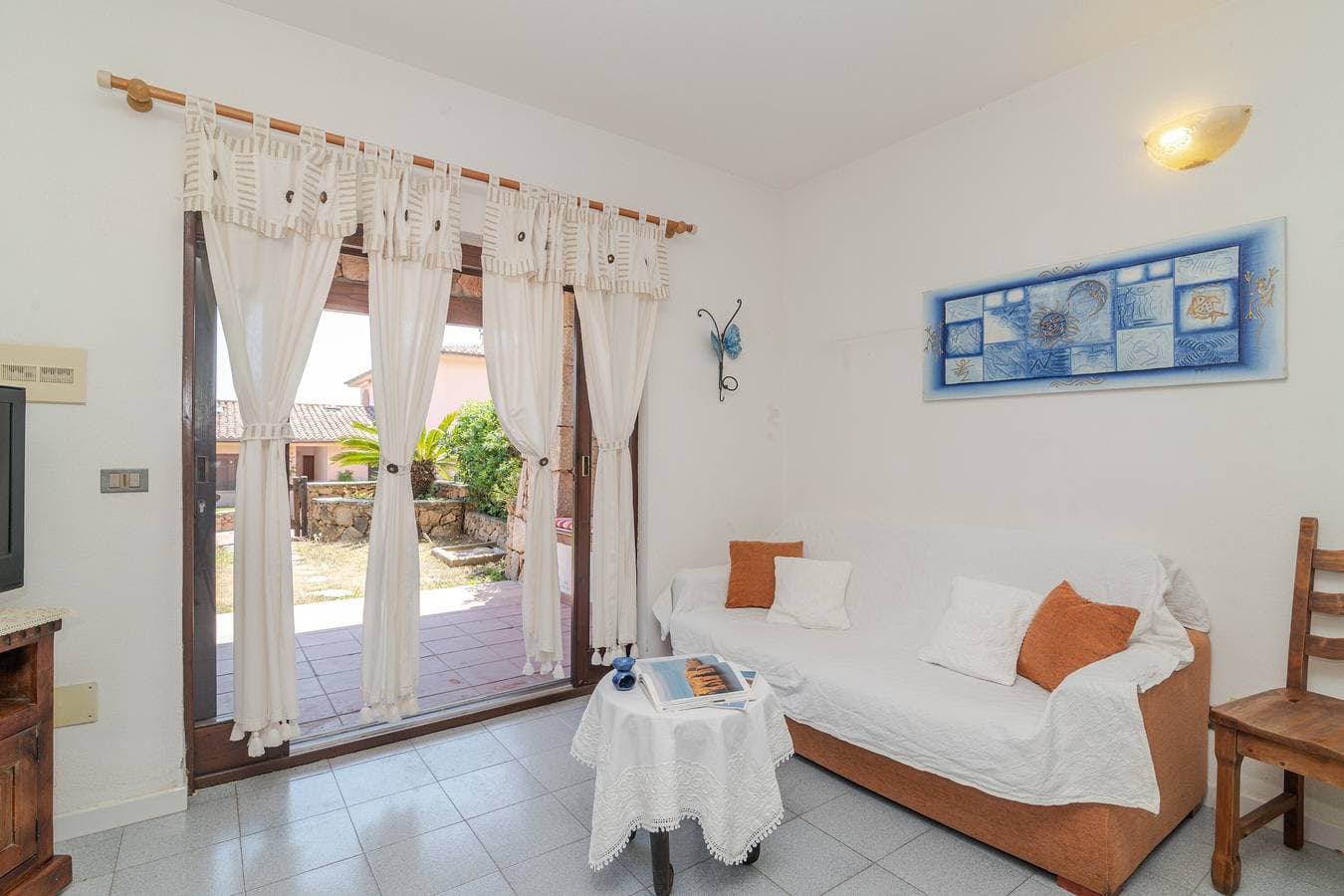 Foto 13 von 27: Apartment 'Trilocale Corallo 300 m vom Strand' mit Gemeinschaftspool, privater Terrasse und privatem Garten