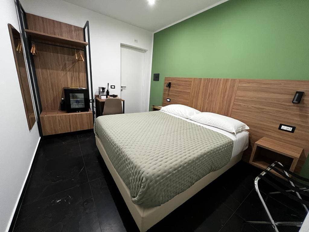 Foto 2 von 5: Triple Room with Private Bathroom