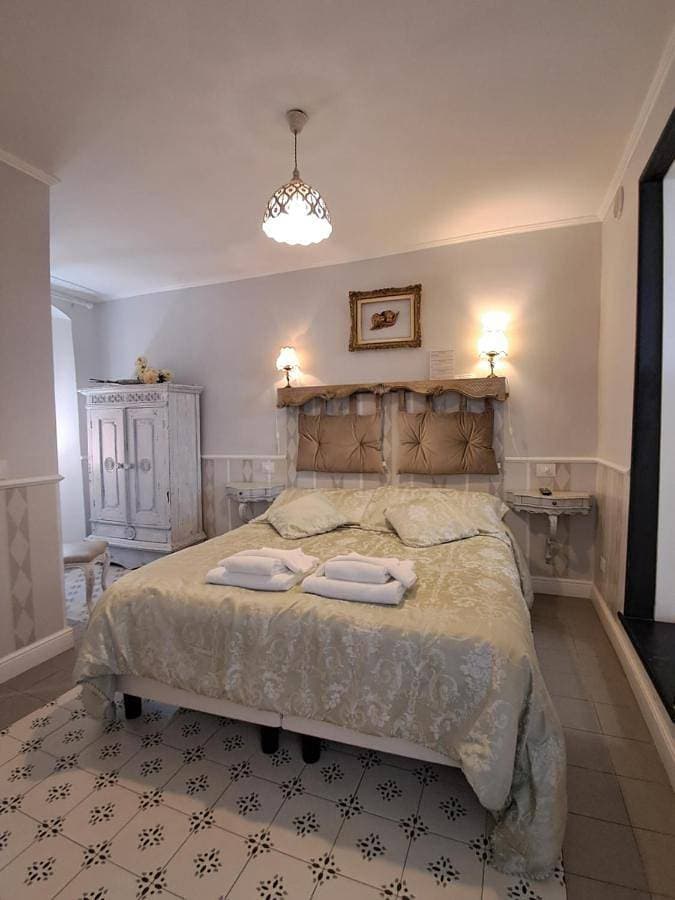 Foto 5 von 11: Triple Room with Private Bathroom