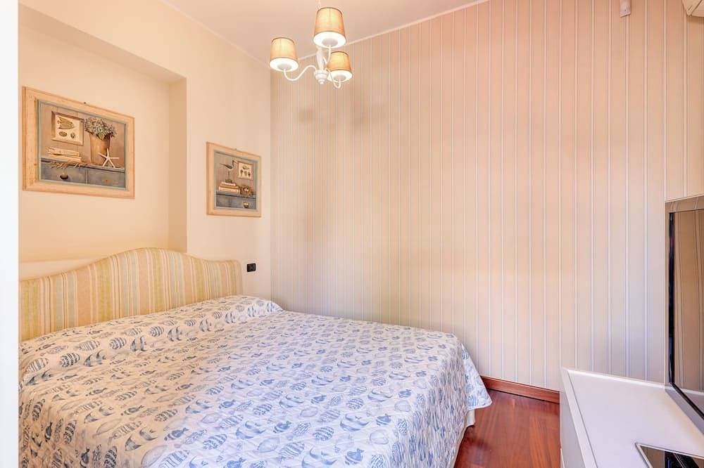 Foto 6 von 26: Palm House apartment in elegant, central setting, a few steps from the sea.