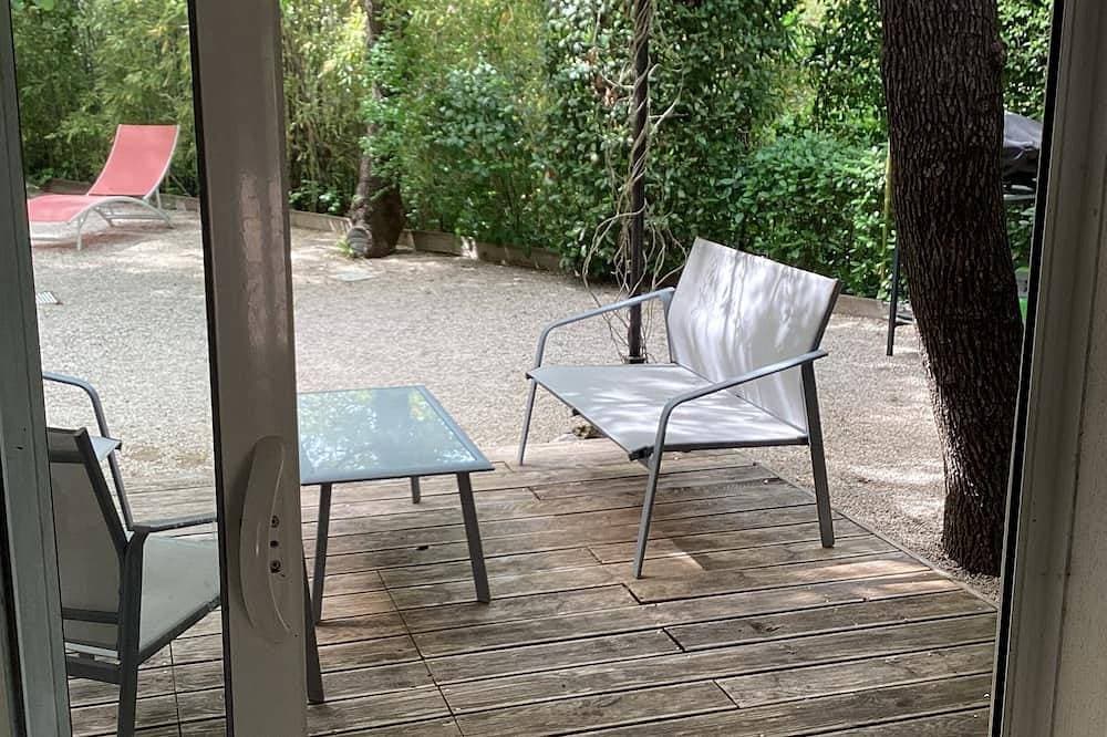 Foto 8 von 9: Studio Avec Terrasse et Pergola Dans Propriété Calme et Sécurisée
