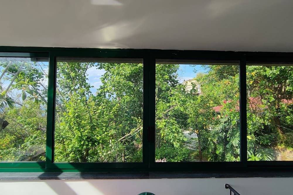 Foto 11 von 16: Camera immersa nel verde