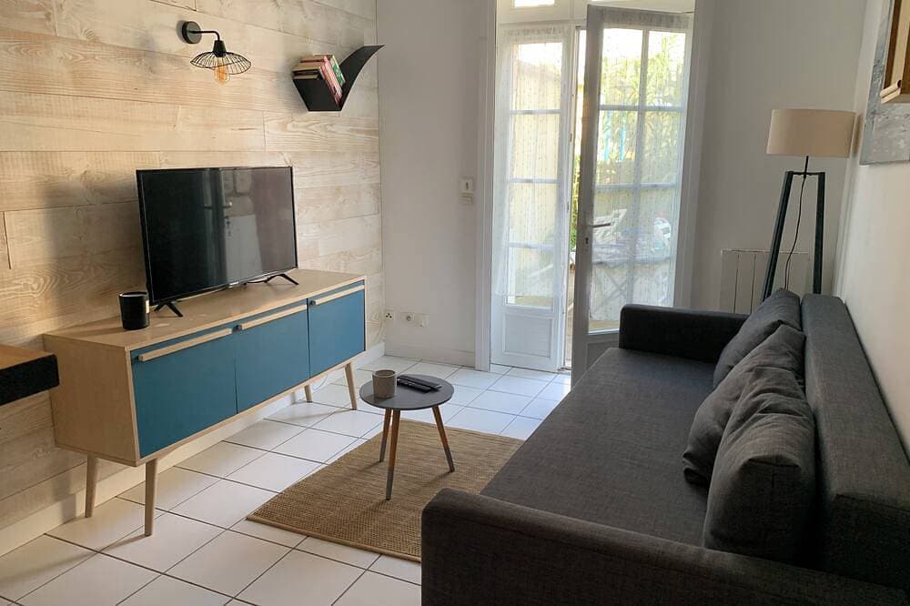 Erdgeschosswohnung mit großer Terrasse 20 Meter vom Strand entfernt 1