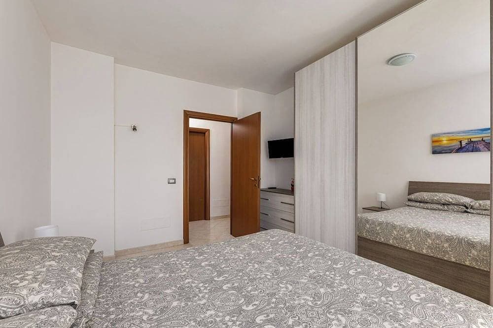 Foto 5 von 18: Casa Confortevole Terrazzo e Posto Auto Coperto!
