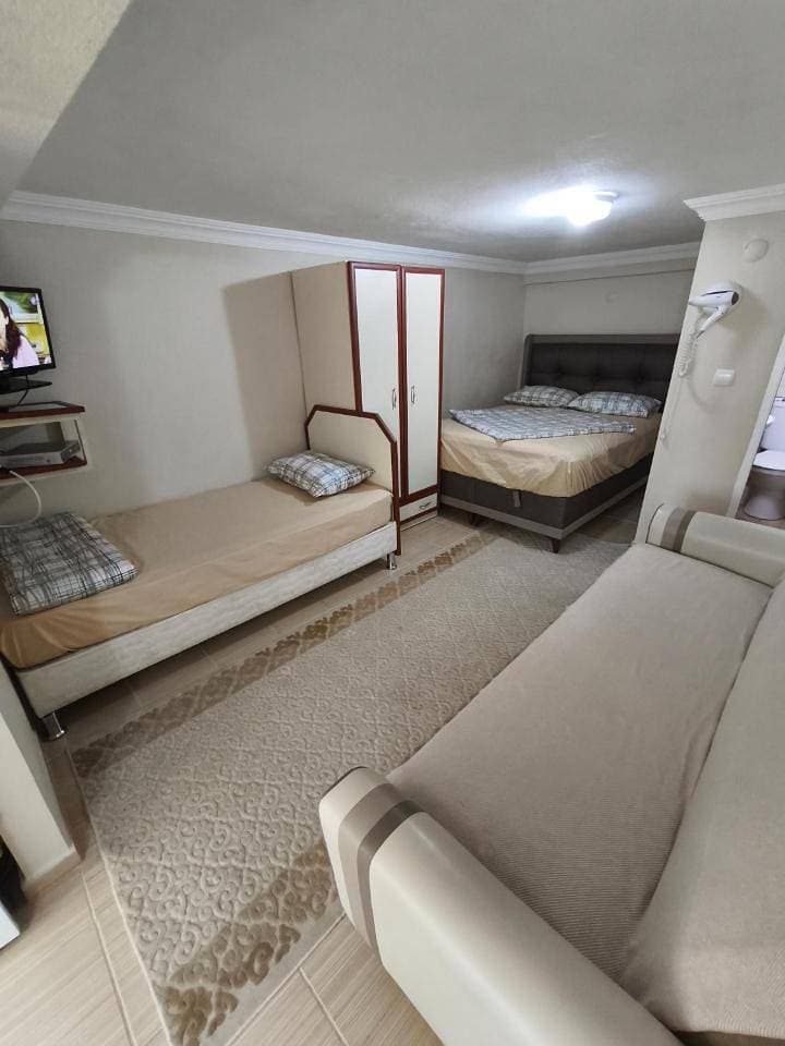 Foto 10 von 26: Quadruple Room with Garden View