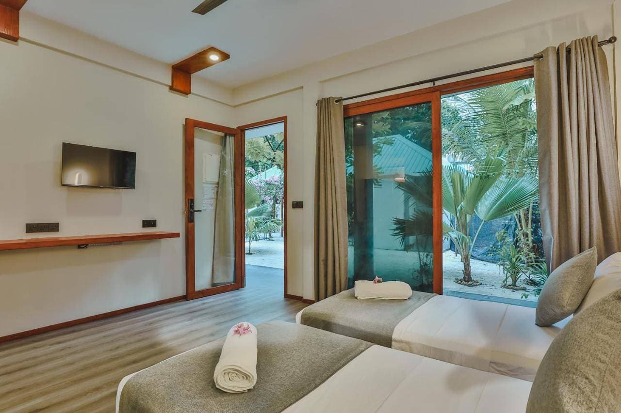 Foto 7 von 12: Standard Twin Room with Garden View