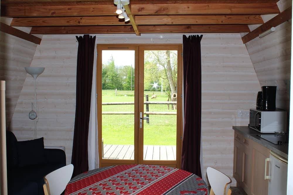 Foto 13 von 15: 2**Lodge Bois Confort 5 minutes from the beach and 10 minutes from Pointe du Hoc