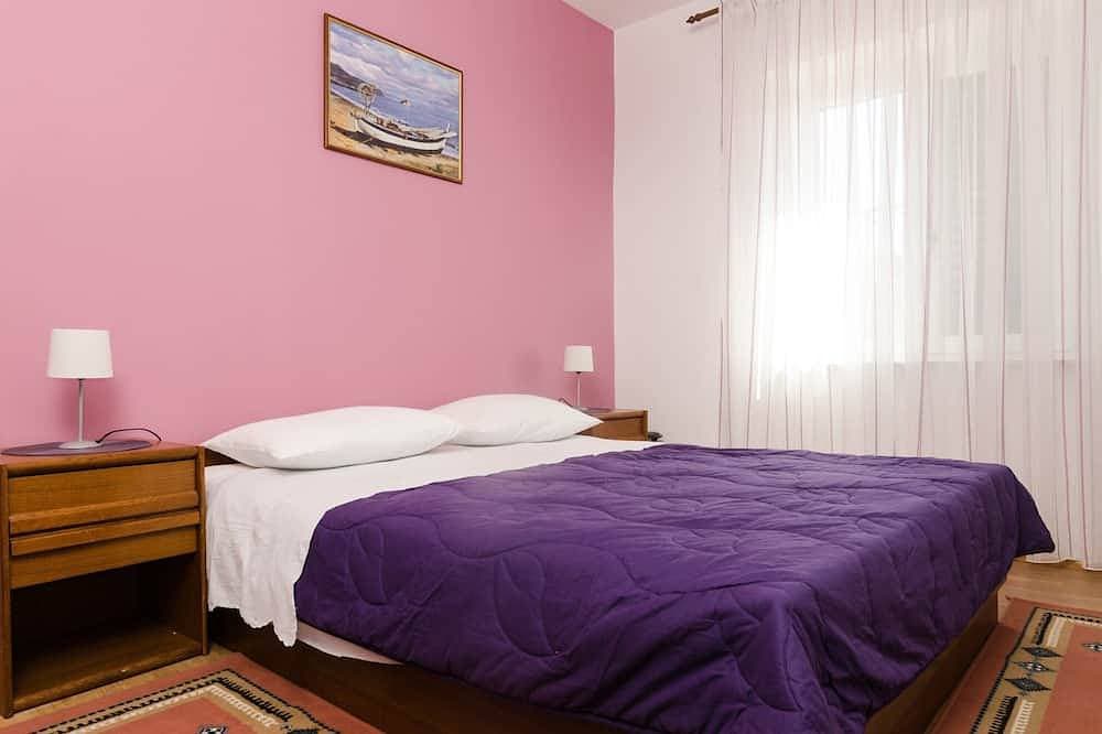 Foto 8 von 17: Guesthouse Moretic - Suite mit 2 Schlafzimmern, Balkon und Meerblick