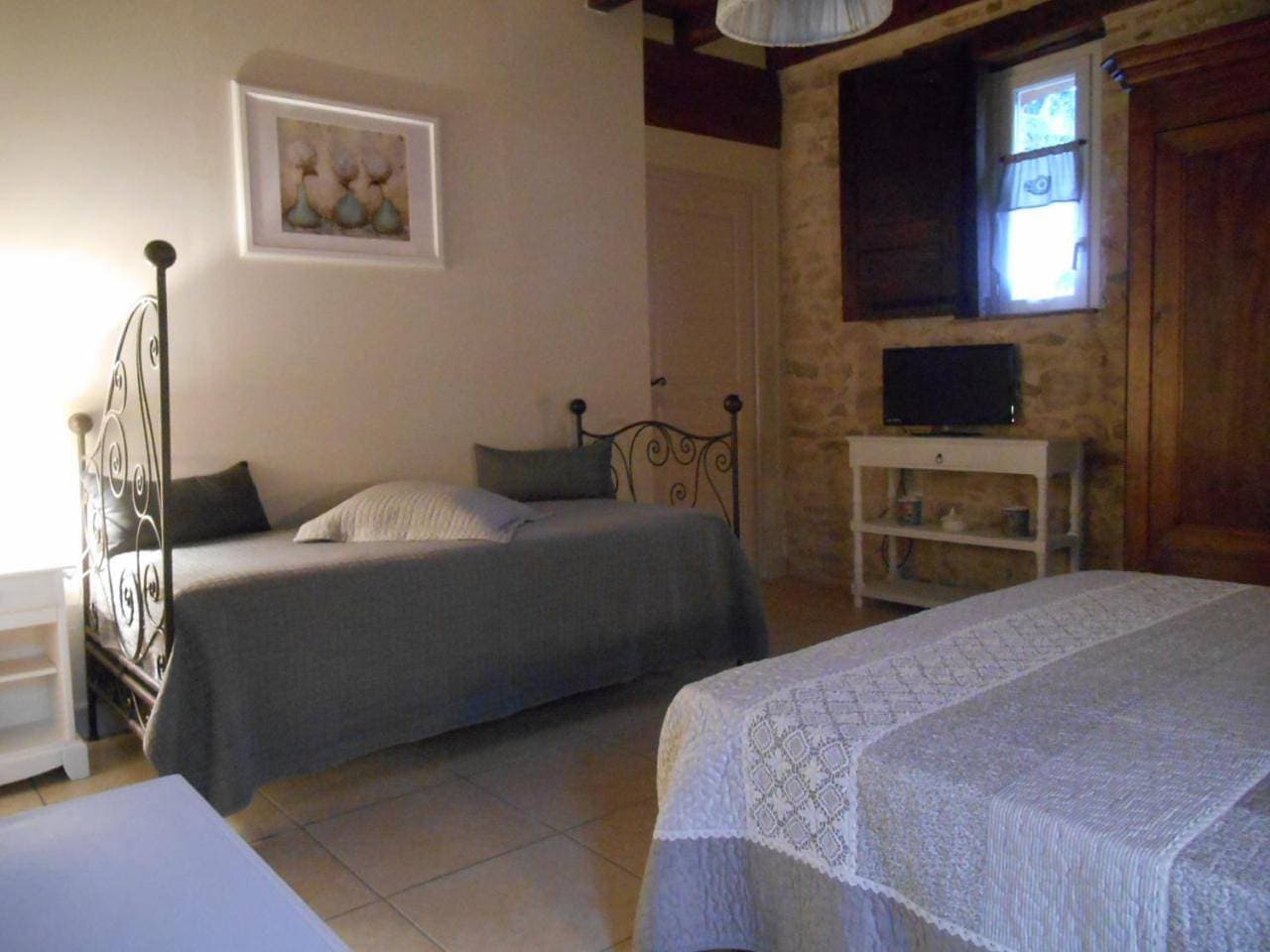 Foto 7 von 16: Triple Room with Private Bathroom
