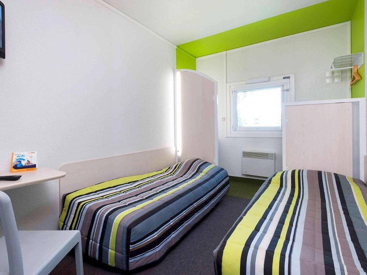 Foto 2 von 13: Twin Room with Shared Bathroom