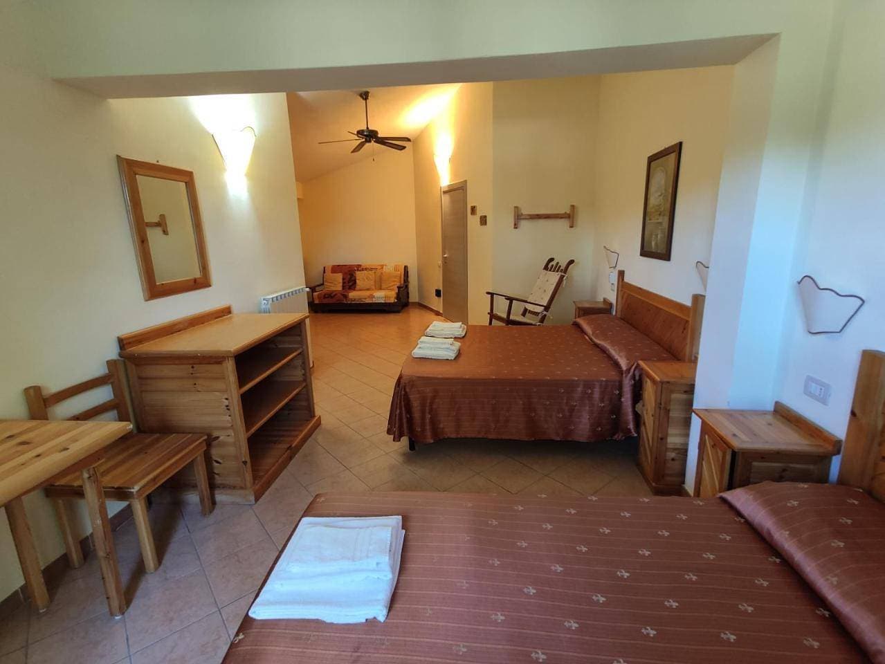 Foto 7 von 19: Quadruple Room with Garden View