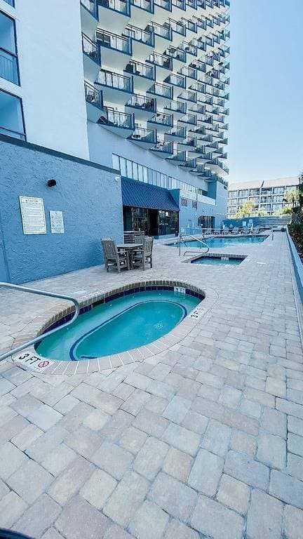 Beachfront Condo, sleeps 6, pools, hot tub, tiki bar, golf carts allowed 1