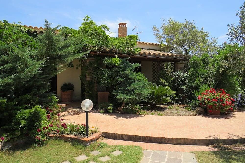 Villa near the sea submerged in greenery 1