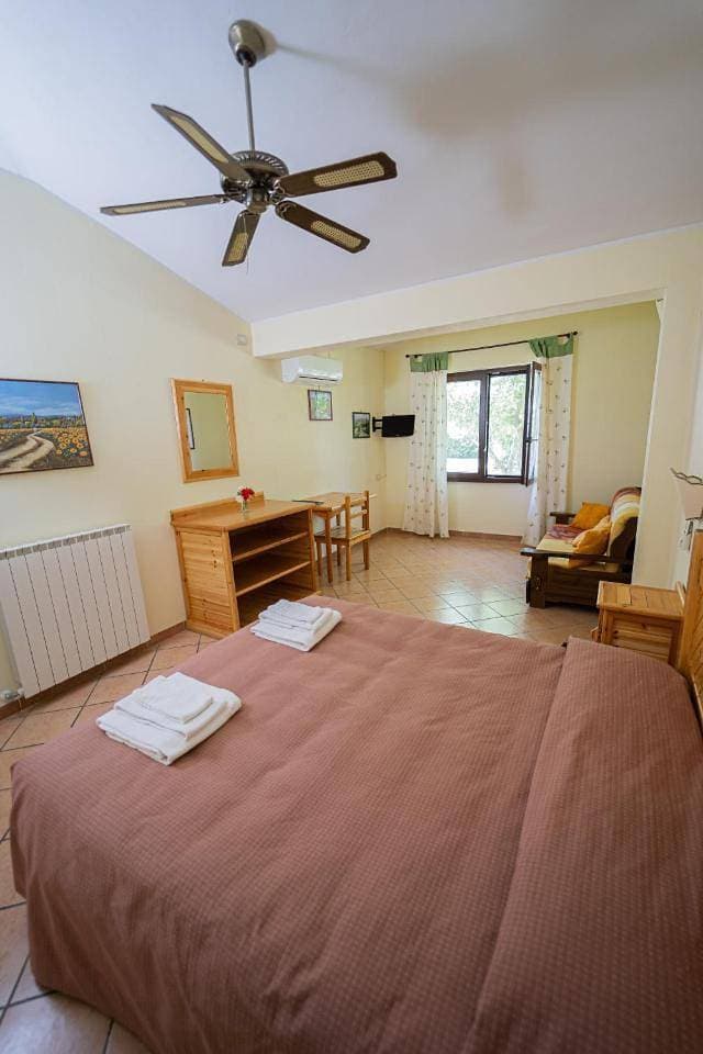 Foto 13 von 19: Quadruple Room with Garden View